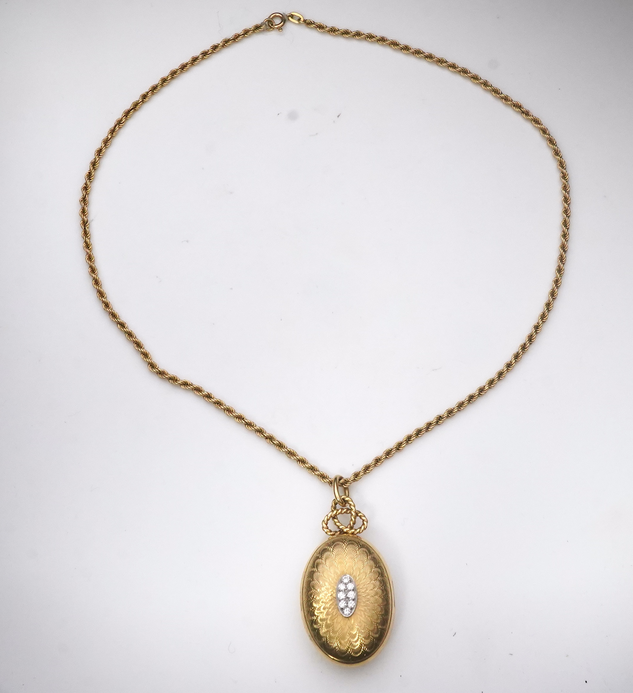 Cartier, an 18ct gold and diamond locket pendant, 1978